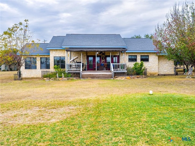 2904 Candace Cir, Horseshoe Bay, TX 78657 - rear view of house with stone siding and a yard