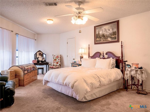 2904 Candace Cir, Horseshoe Bay, TX 78657 - carpeted bedroom with a textured ceiling and a ceiling fan