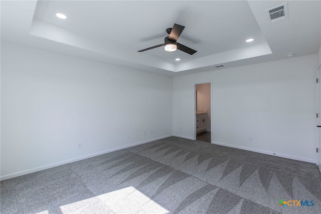575 Live Oak Dr, Bertram, TX 78605 - carpeted spare room with a tray ceiling, recessed lighting, and a ceiling fan