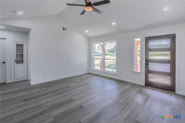 575 Live Oak Dr, Bertram, TX 78605 - unfurnished living room featuring vaulted ceiling, a ceiling fan, wood finished floors, and recessed lighting