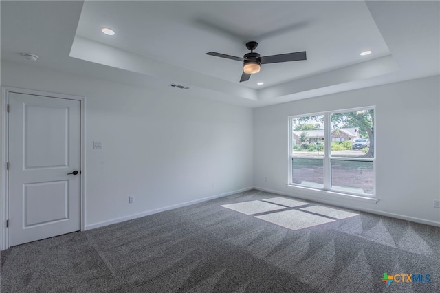 575 Live Oak Dr, Bertram, TX 78605 - carpeted empty room featuring a tray ceiling, recessed lighting, ceiling fan, and a smoke detector