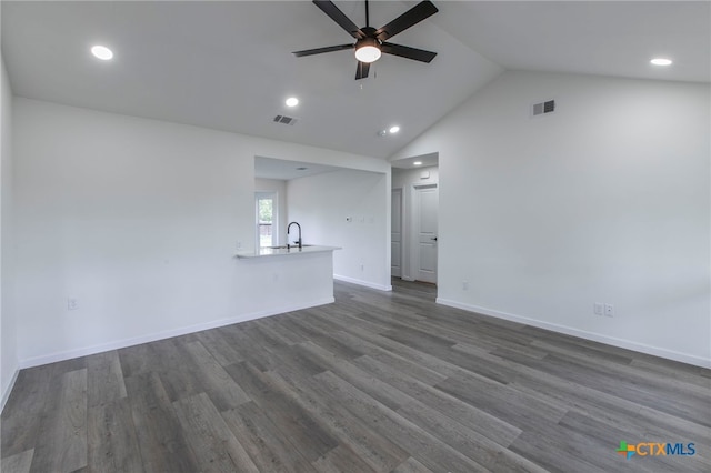 575 Live Oak Dr, Bertram, TX 78605 - unfurnished living room with ceiling fan, lofted ceiling, dark wood-style flooring, and recessed lighting