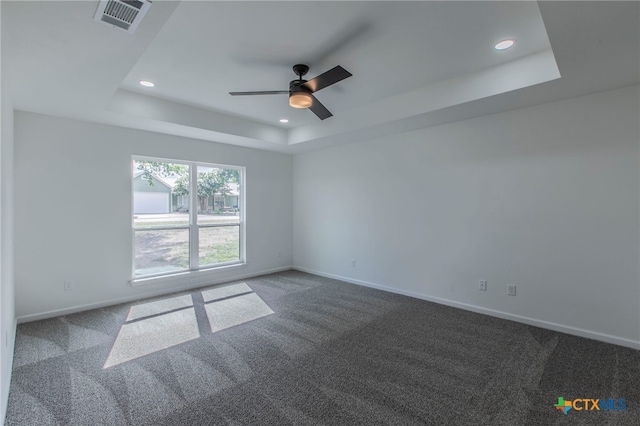 575 Live Oak Dr, Bertram, TX 78605 - carpeted spare room featuring a raised ceiling, recessed lighting, and a ceiling fan