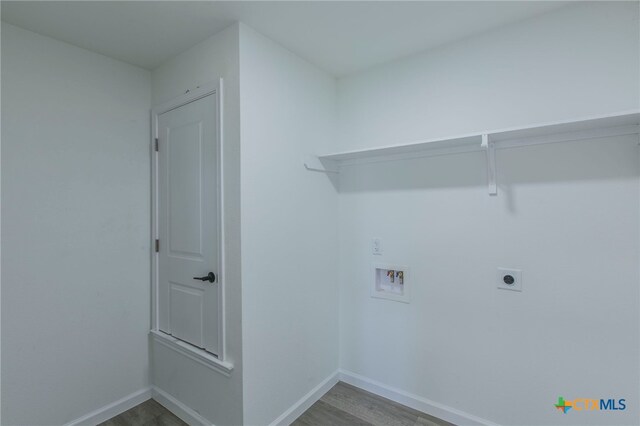 575 Live Oak Dr, Bertram, TX 78605 - laundry room featuring washer hookup, wood finished floors, and hookup for an electric dryer