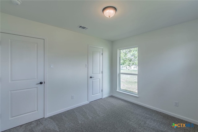 575 Live Oak Dr, Bertram, TX 78605 - unfurnished bedroom with carpet floors and baseboards
