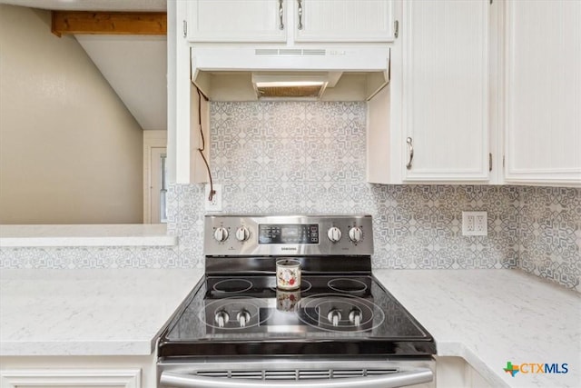 kitchen with white cabinetry, tasteful backsplash, lofted ceiling with beams, under cabinet range hood, and electric stove