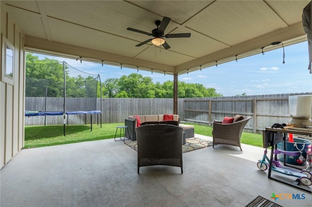 2635 Bolzano Trl, Temple, TX 76502 - view of patio / terrace featuring ceiling fan and a trampoline