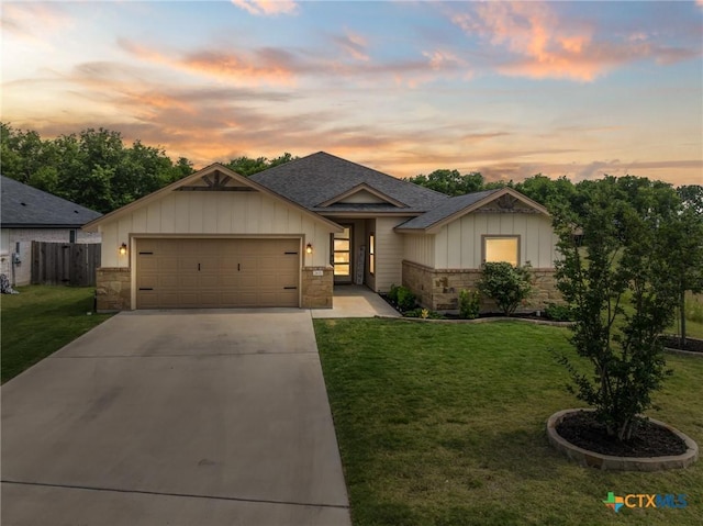 2635 Bolzano Trl, Temple, TX 76502 - view of front of home featuring an attached garage, board and batten siding, concrete driveway, stone siding, and roof with shingles