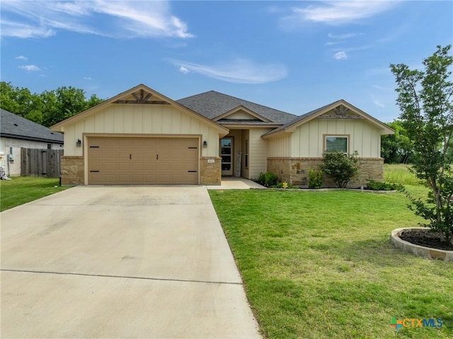 2635 Bolzano Trl, Temple, TX 76502 - single story home featuring an attached garage, board and batten siding, concrete driveway, a shingled roof, and brick siding