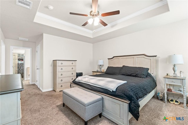 2635 Bolzano Trl, Temple, TX 76502 - bedroom with a tray ceiling, light carpet, ornamental molding, a ceiling fan, and baseboards