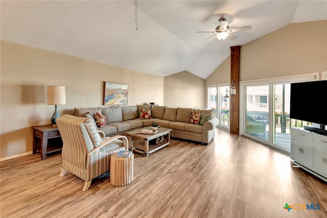 living room with ceiling fan, light wood-type flooring, and lofted ceiling