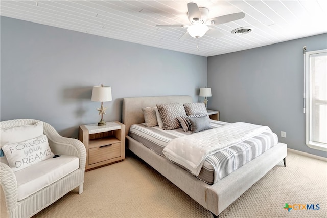 bedroom featuring light carpet and ceiling fan