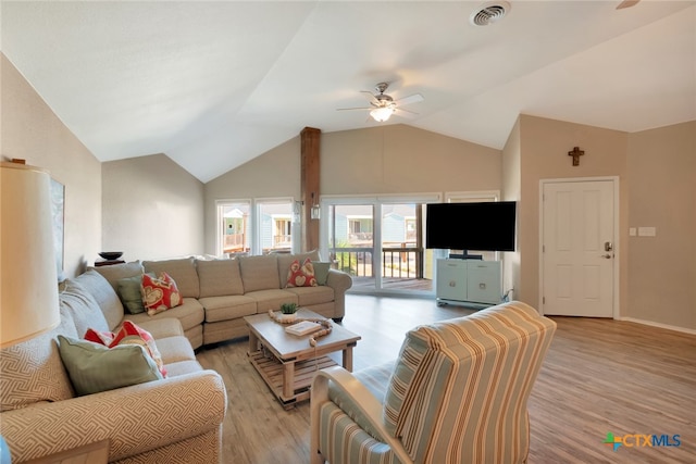 living room featuring light hardwood / wood-style flooring, vaulted ceiling, and ceiling fan