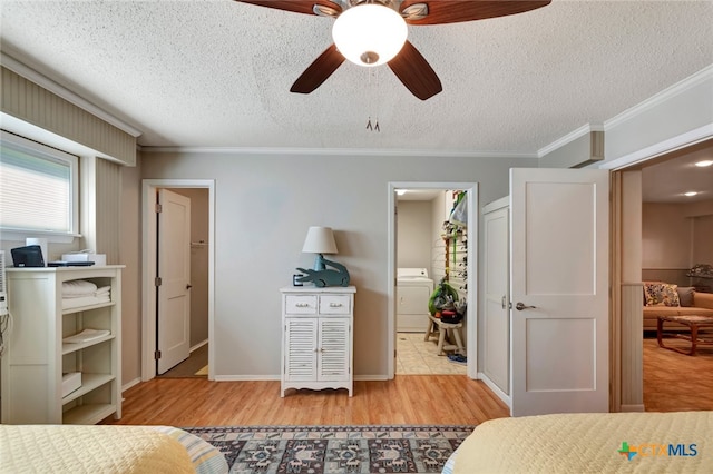 bedroom featuring ensuite bath, ceiling fan, light hardwood / wood-style flooring, crown molding, and a textured ceiling