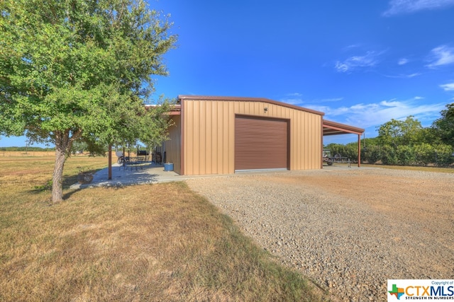 garage featuring a yard