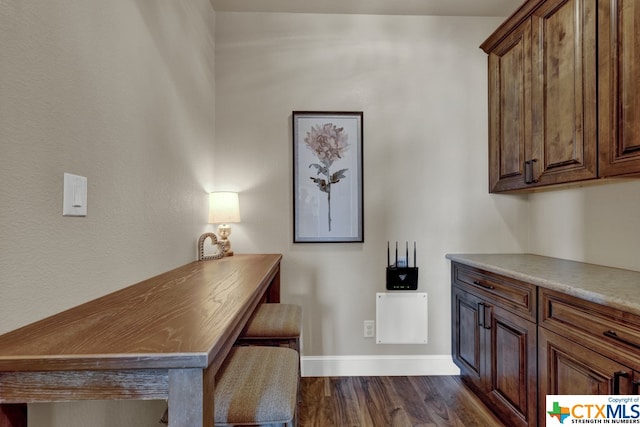 office space with dark hardwood / wood-style floors