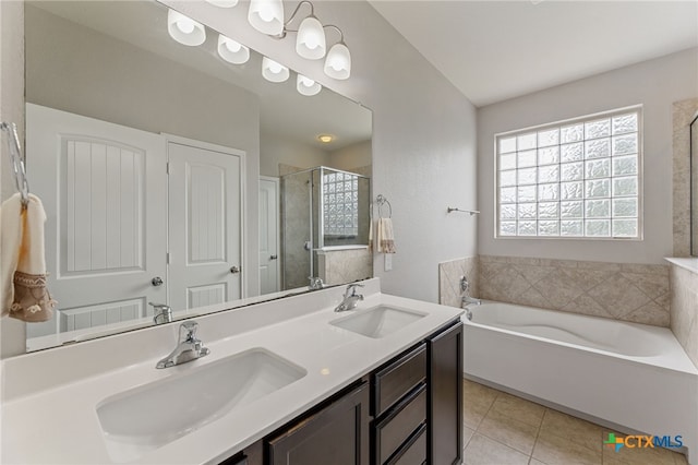 bathroom featuring independent shower and bath, vanity, and tile patterned flooring