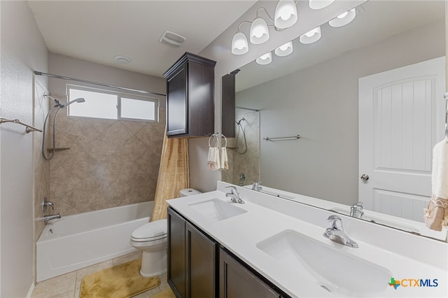 full bathroom featuring toilet, vanity, tile patterned floors, and shower / bathtub combination with curtain