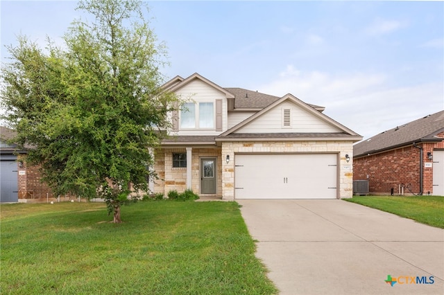 view of front of property featuring a garage and a front yard