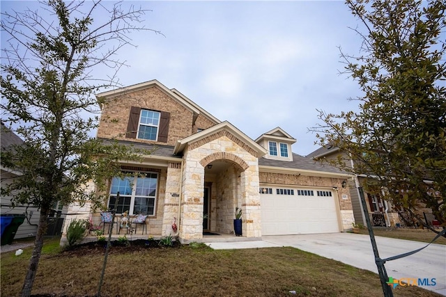 view of front facade with a garage and a front lawn