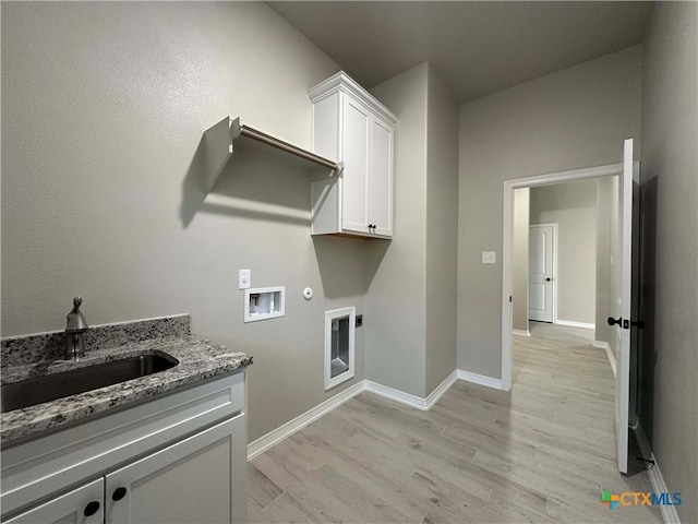 laundry room with gas dryer hookup, sink, cabinets, washer hookup, and electric dryer hookup