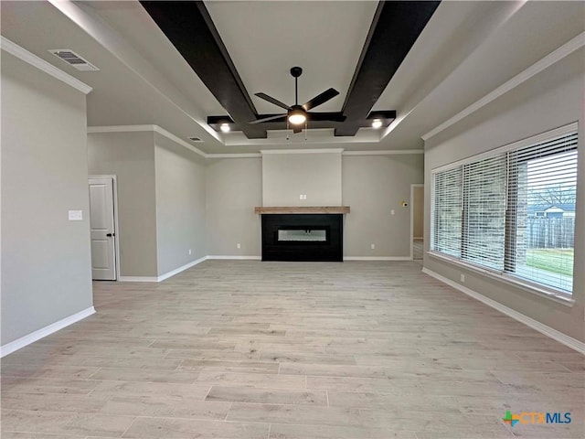 unfurnished living room with beam ceiling, ornamental molding, light hardwood / wood-style floors, and ceiling fan