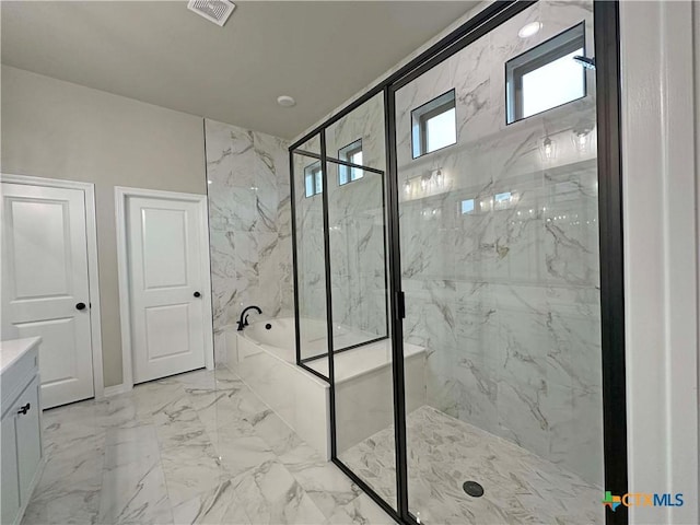 bathroom with vanity and separate shower and tub