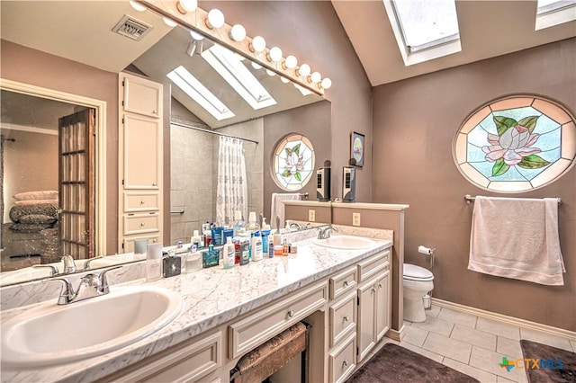 3618 Bobcat Trl, Temple, TX 76502 - bathroom featuring a skylight, vaulted ceiling, tile patterned floors, toilet, and a tile shower