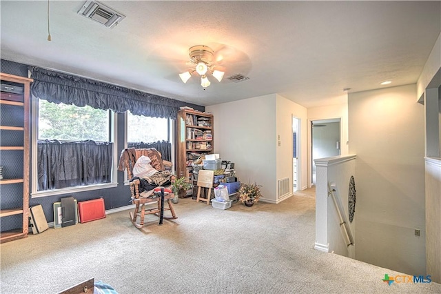 3618 Bobcat Trl, Temple, TX 76502 - sitting room featuring an upstairs landing, carpet, a ceiling fan, and baseboards