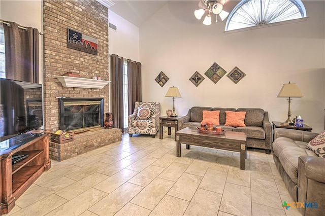 3618 Bobcat Trl, Temple, TX 76502 - living area featuring high vaulted ceiling, a ceiling fan, and a brick fireplace