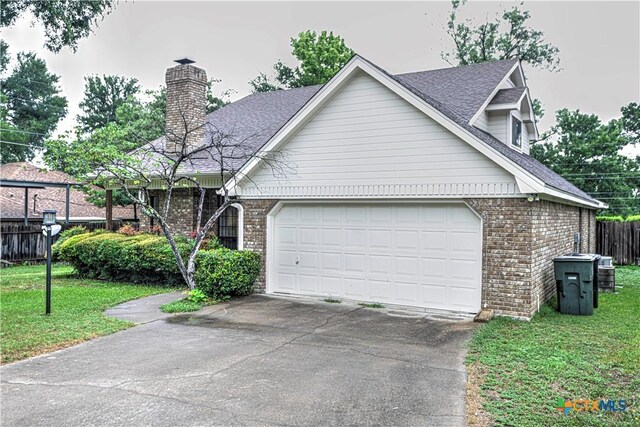 3618 Bobcat Trl, Temple, TX 76502 - view of front of house featuring brick siding, driveway, an attached garage, and a shingled roof