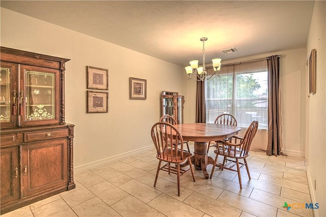 3618 Bobcat Trl, Temple, TX 76502 - dining room with a chandelier, light tile patterned floors, and baseboards
