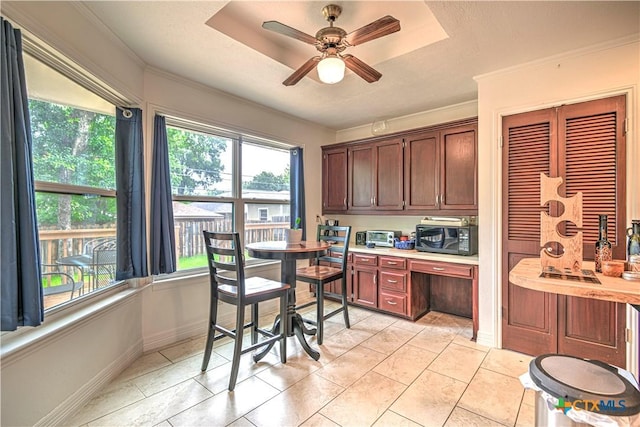 3618 Bobcat Trl, Temple, TX 76502 - kitchen featuring healthy amount of natural light, black microwave, light countertops, and crown molding