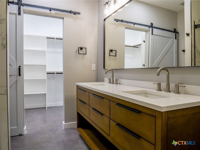 bathroom with vanity and concrete floors