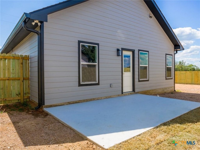 back of house with a patio area