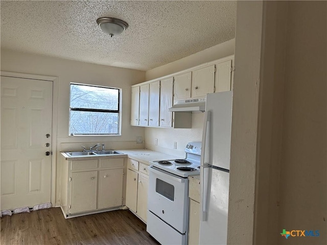 kitchen featuring a textured ceiling, white appliances, sink, white cabinets, and dark hardwood / wood-style floors