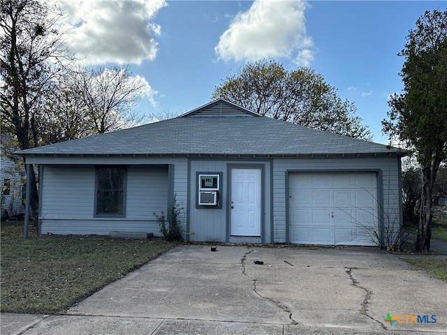 ranch-style house featuring a garage