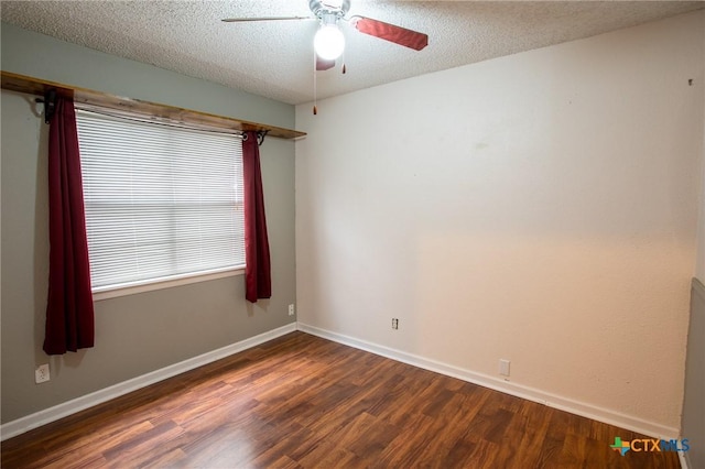 empty room featuring baseboards, a textured ceiling, wood finished floors, and a ceiling fan