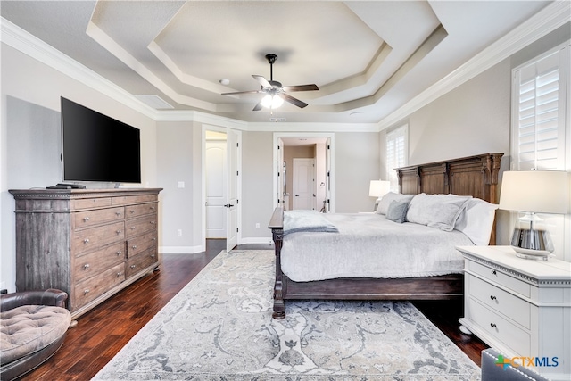 bedroom featuring ornamental molding, a raised ceiling, ceiling fan, and dark hardwood / wood-style floors