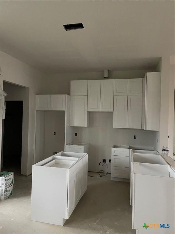 kitchen featuring white cabinets and a kitchen island