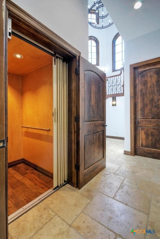 interior space featuring hardwood / wood-style floors and a notable chandelier