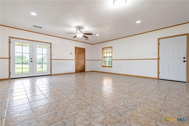 679 Royal Rd, Port Lavaca, TX 77979 - spare room with ceiling fan, french doors, wainscoting, ornamental molding, and recessed lighting
