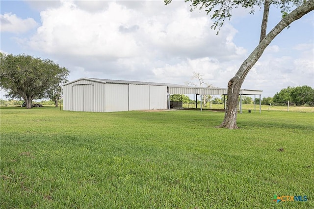 679 Royal Rd, Port Lavaca, TX 77979 - view of green lawn with an outbuilding and an outdoor structure