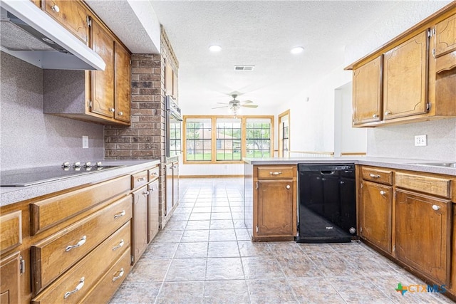 679 Royal Rd, Port Lavaca, TX 77979 - kitchen featuring black appliances, under cabinet range hood, light countertops, a peninsula, and ceiling fan