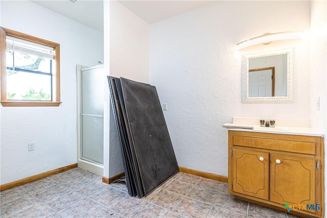 679 Royal Rd, Port Lavaca, TX 77979 - bathroom with baseboards, a stall shower, and vanity