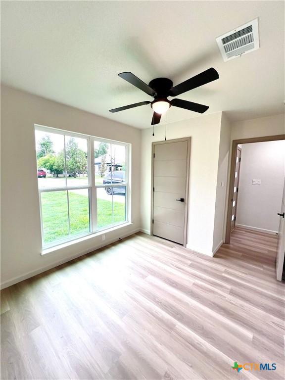 107 S 23rd St, Temple, TX 76504 - spare room featuring light wood-type flooring and baseboards