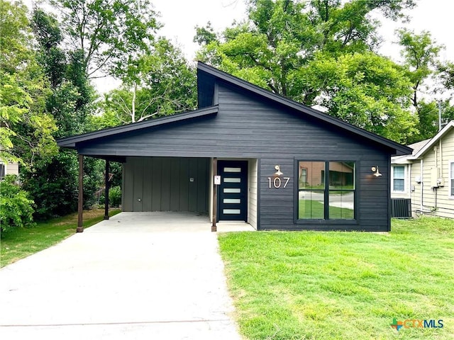 107 S 23rd St, Temple, TX 76504 - view of front of property with driveway, a front yard, and an attached carport