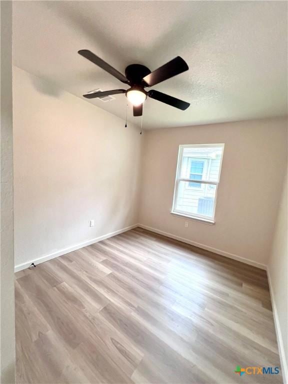 107 S 23rd St, Temple, TX 76504 - unfurnished room featuring wood finished floors, baseboards, and ceiling fan