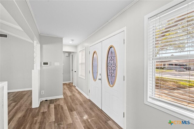 116 Guinevere St, Victoria, TX 77904 - foyer entrance with crown molding and wood-type flooring