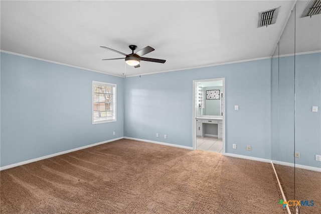 116 Guinevere St, Victoria, TX 77904 - spare room featuring ceiling fan, ornamental molding, and light carpet